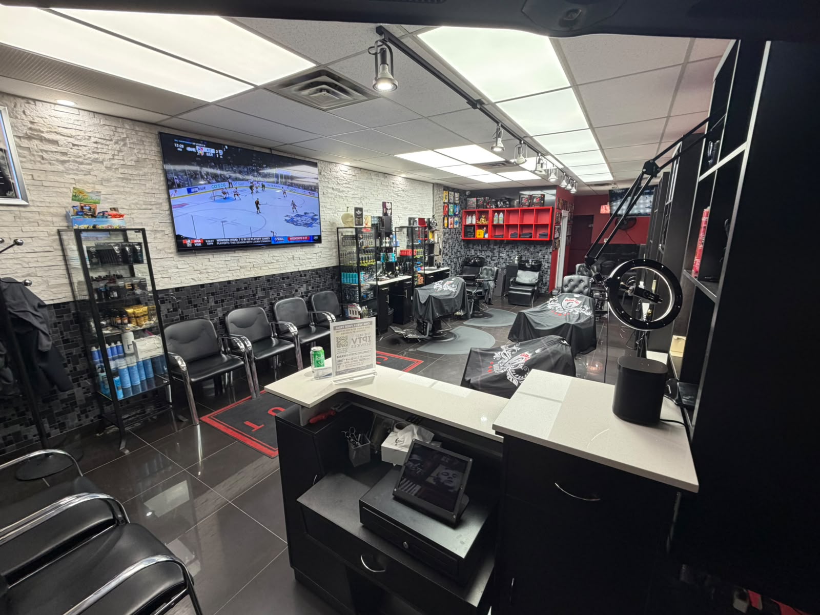 Waiting area and TV inside Clean Cut